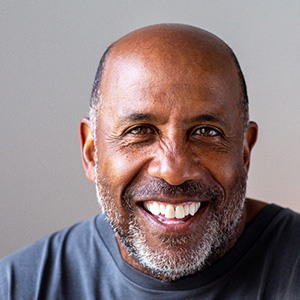 Closeup of man in gray shirt smiling