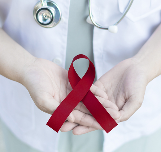 Doctor holding ribbon for oral cancer awareness