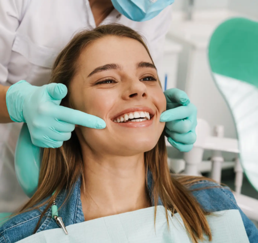 Showing patient their smile in a handheld mirror